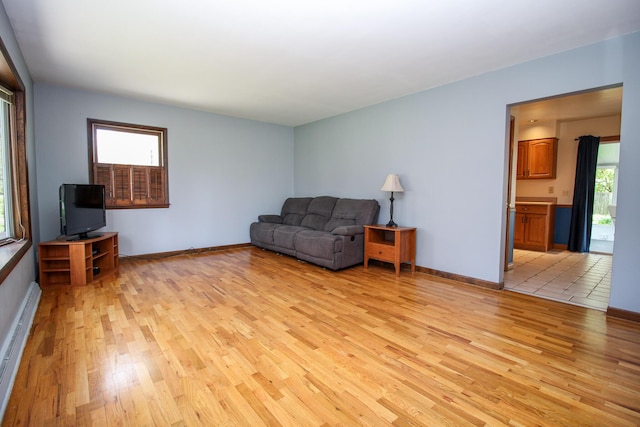 6339 Westchester St, Portage, MI 49024 - living room featuring light wood-style floors and baseboards
