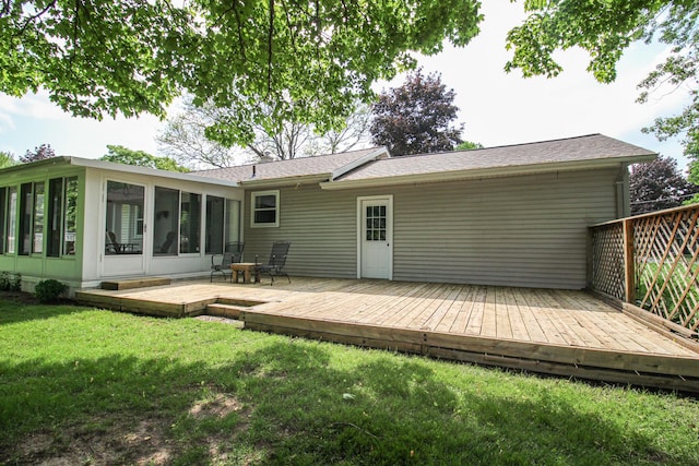 6339 Westchester St, Portage, MI 49024 - back of house featuring a sunroom, a yard, a deck, and a shingled roof
