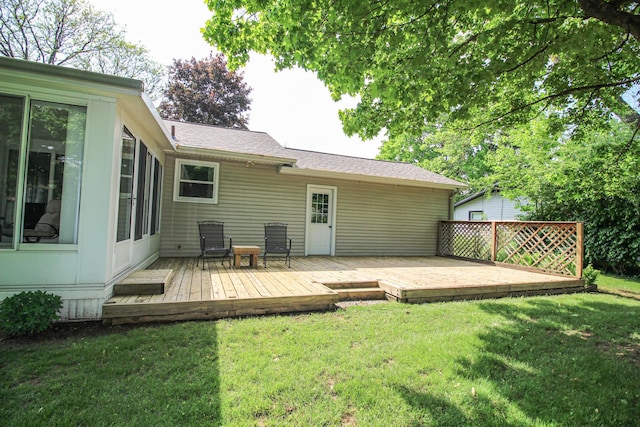 6339 Westchester St, Portage, MI 49024 - rear view of house with a wooden deck, a lawn, and a shingled roof