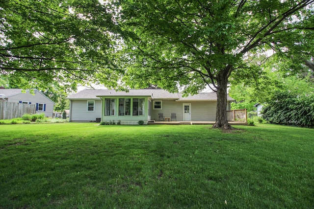 6339 Westchester St, Portage, MI 49024 - back of property featuring a lawn and a sunroom
