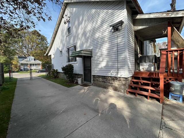 17330 Waltham St, Detroit, MI 48205 - view of property exterior with fence, a deck, and a gate