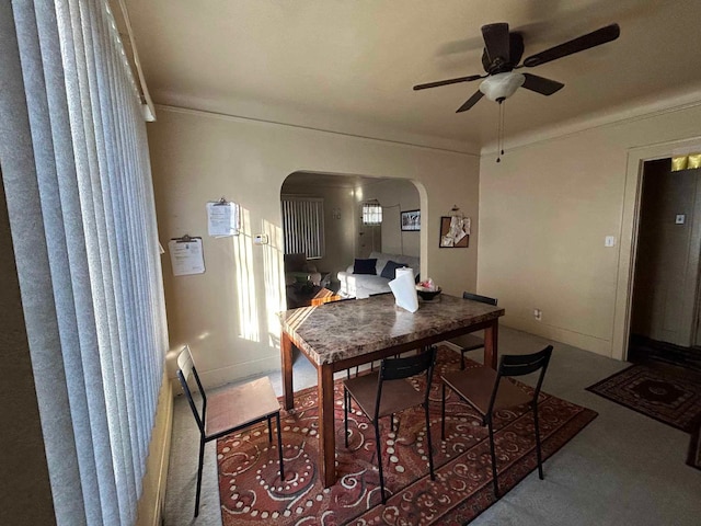 17330 Waltham St, Detroit, MI 48205 - carpeted dining room featuring arched walkways, a ceiling fan, and crown molding