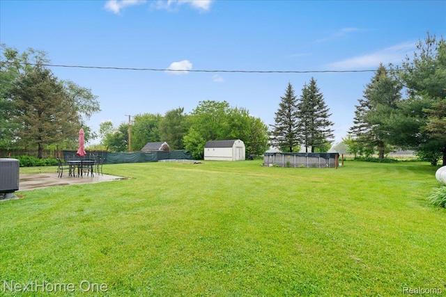 9220 Crofoot Rd, Fowlerville, MI 48836 - view of yard featuring a patio and central AC
