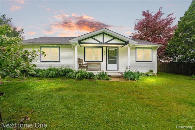 9220 Crofoot Rd, Fowlerville, MI 48836 - view of front of house featuring covered porch and a yard