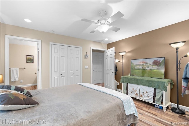 9220 Crofoot Rd, Fowlerville, MI 48836 - bedroom with baseboards, wood finished floors, a closet, ceiling fan, and recessed lighting