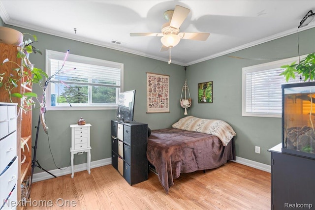 9220 Crofoot Rd, Fowlerville, MI 48836 - bedroom featuring wood finished floors, ornamental molding, baseboards, and a ceiling fan