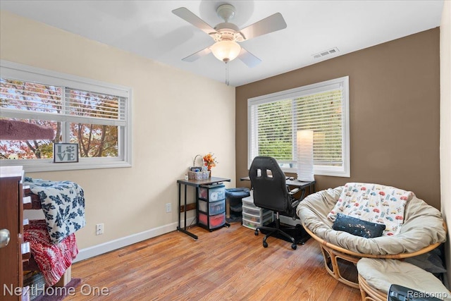 9220 Crofoot Rd, Fowlerville, MI 48836 - office space with baseboards, wood finished floors, and a ceiling fan