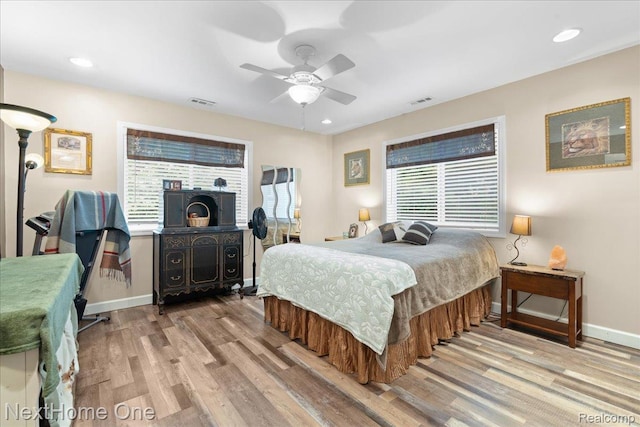 9220 Crofoot Rd, Fowlerville, MI 48836 - bedroom featuring wood finished floors, baseboards, a ceiling fan, and recessed lighting