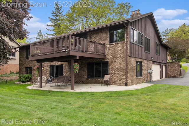 4976 Ledgewood Dr, Commerce Twp, MI 48382 - rear view of property featuring brick siding, a lawn, an attached garage, a chimney, and a patio