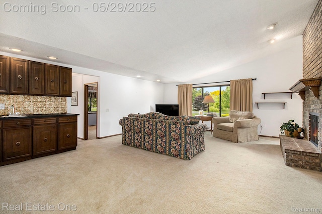4976 Ledgewood Dr, Commerce Twp, MI 48382 - living area with light colored carpet, a brick fireplace, lofted ceiling, recessed lighting, and a textured ceiling