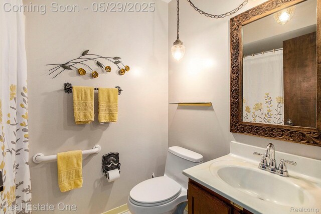 4976 Ledgewood Dr, Commerce Twp, MI 48382 - bathroom featuring vanity and toilet