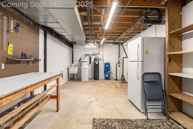 4976 Ledgewood Dr, Commerce Twp, MI 48382 - unfinished below grade area with freestanding refrigerator, a water pressure tank, a workshop area, and a water softener