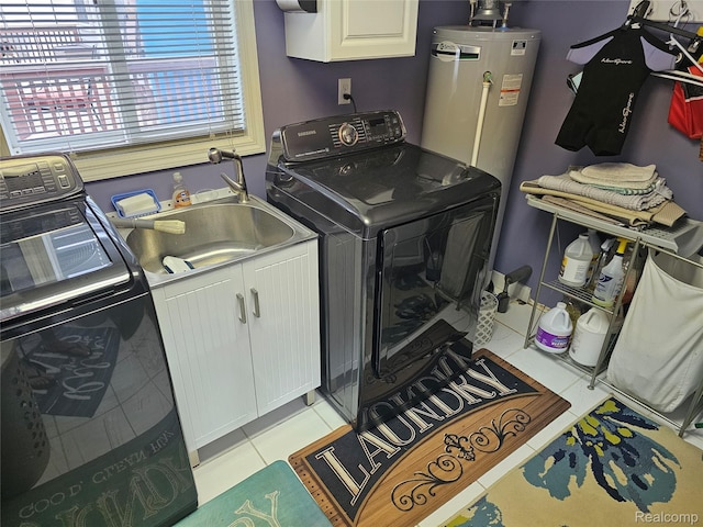 8889 Anchor Bay Dr, Clay, MI 48001 - laundry room with washer and clothes dryer, cabinet space, and light tile patterned floors