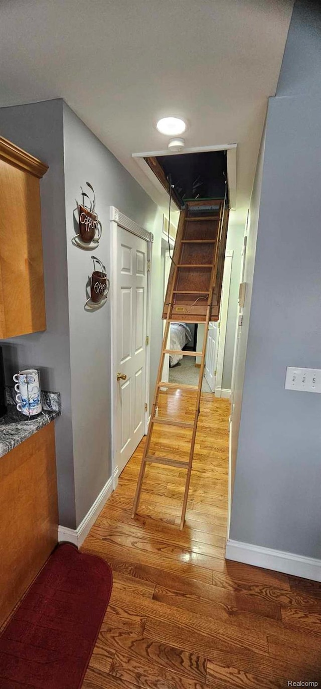 8889 Anchor Bay Dr, Clay, MI 48001 - hall with baseboards and wood finished floors