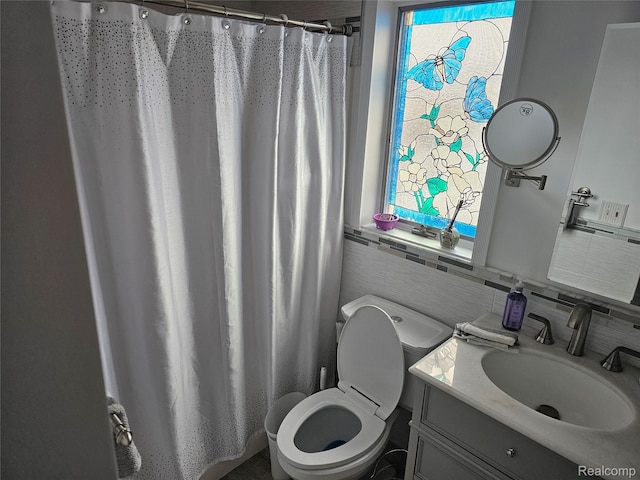 8889 Anchor Bay Dr, Clay, MI 48001 - full bathroom with toilet, tile walls, vanity, a shower with shower curtain, and plenty of natural light