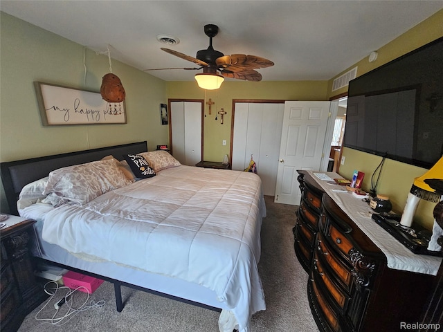8889 Anchor Bay Dr, Clay, MI 48001 - bedroom with carpet flooring, multiple closets, and ceiling fan