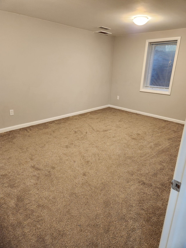 501 Virginia Ave, East Lansing, MI 48823 - carpeted spare room featuring baseboards
