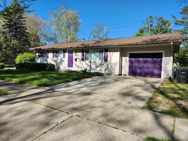 501 Virginia Ave, East Lansing, MI 48823 - ranch-style house featuring a front lawn, a garage, and driveway