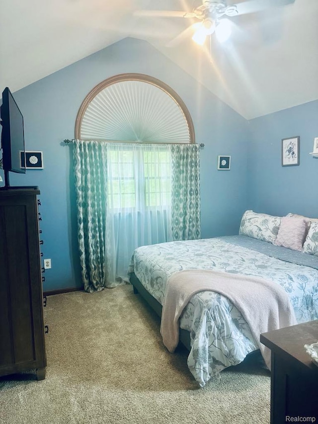 3217 Autumn View Ln, Metamora, MI 48455 - carpeted bedroom featuring lofted ceiling and a ceiling fan