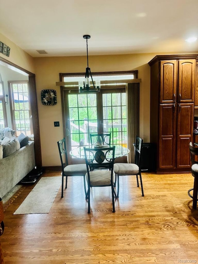 3217 Autumn View Ln, Metamora, MI 48455 - dining space featuring light wood-type flooring and baseboards