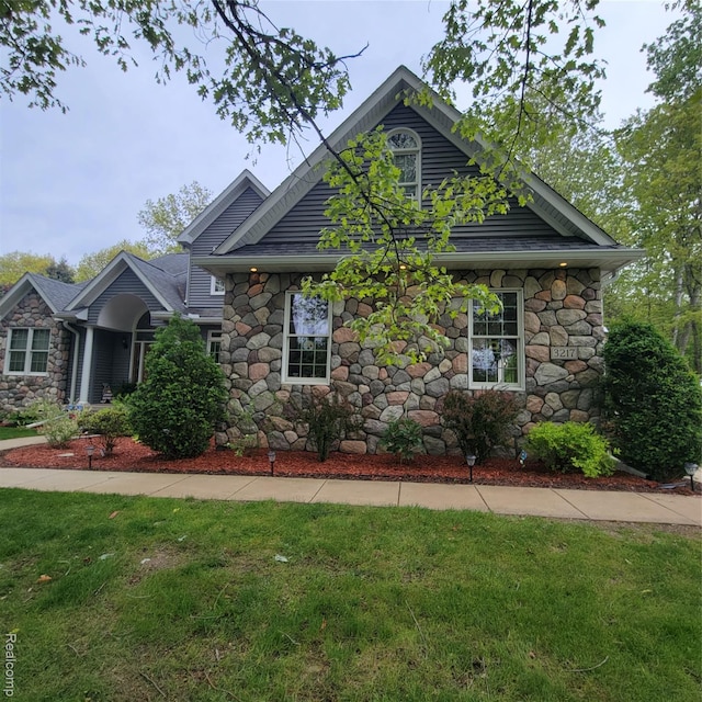 3217 Autumn View Ln, Metamora, MI 48455 - view of front of house with stone siding and a front yard
