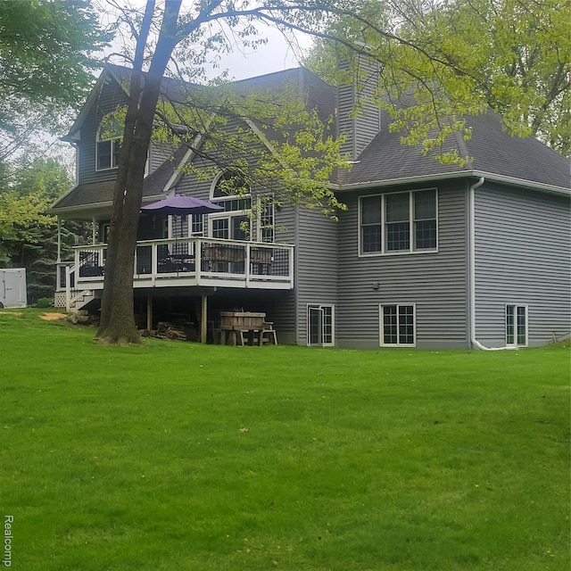 3217 Autumn View Ln, Metamora, MI 48455 - rear view of property with a chimney, a lawn, and a deck