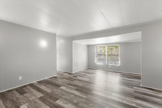 351 N Squirrel Rd, Auburn Hills, MI 48326 - unfurnished room featuring wood finished floors and a decorative wall