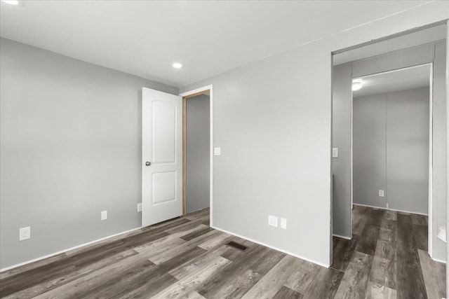 351 N Squirrel Rd, Auburn Hills, MI 48326 - unfurnished bedroom with wood finished floors, recessed lighting, and baseboards