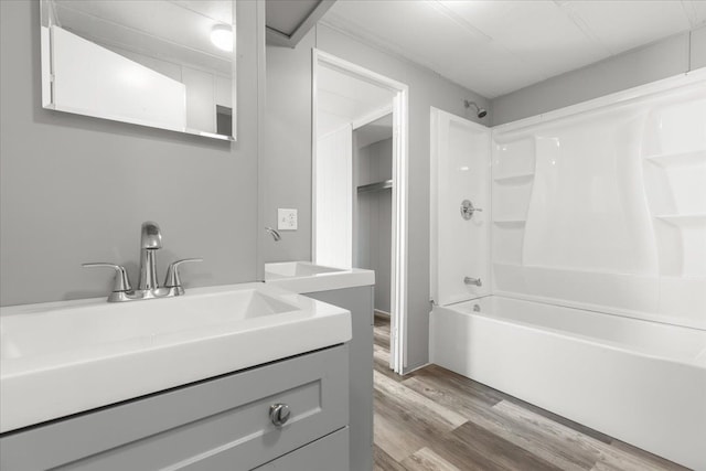 351 N Squirrel Rd, Auburn Hills, MI 48326 - full bath featuring washtub / shower combination, wood finished floors, and vanity
