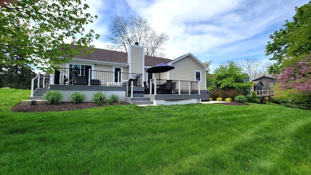 6192 N Shore Dr, West Bloomfield, MI 48324 - back of property featuring a yard, a chimney, a deck, and a shingled roof