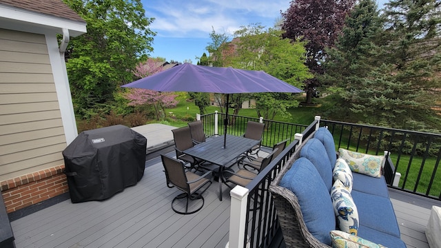 6192 N Shore Dr, West Bloomfield, MI 48324 - deck featuring outdoor dining area, grilling area, and a yard