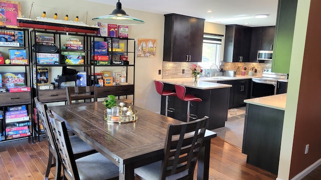 6192 N Shore Dr, West Bloomfield, MI 48324 - dining area with wood finished floors and recessed lighting