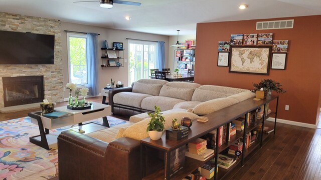 6192 N Shore Dr, West Bloomfield, MI 48324 - living area featuring a ceiling fan, baseboards, hardwood / wood-style floors, recessed lighting, and a stone fireplace