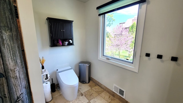 6192 N Shore Dr, West Bloomfield, MI 48324 - bathroom with baseboards and toilet