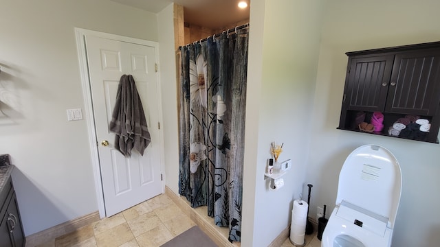 6192 N Shore Dr, West Bloomfield, MI 48324 - bathroom featuring stacked washer / dryer, baseboards, curtained shower, stone finish flooring, and vanity