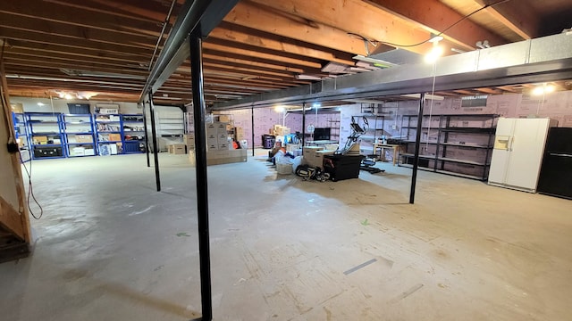 6192 N Shore Dr, West Bloomfield, MI 48324 - unfinished below grade area featuring white fridge with ice dispenser and refrigerator