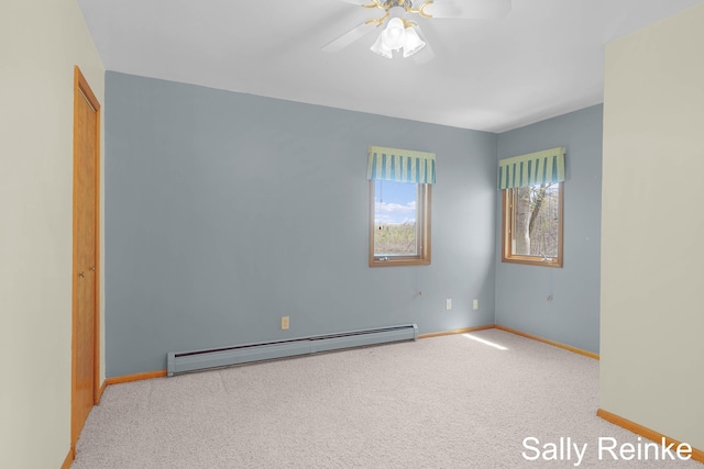 16972 James Dr, Big Rapids, MI 49307 - unfurnished room with a baseboard radiator, baseboards, carpet floors, and a ceiling fan