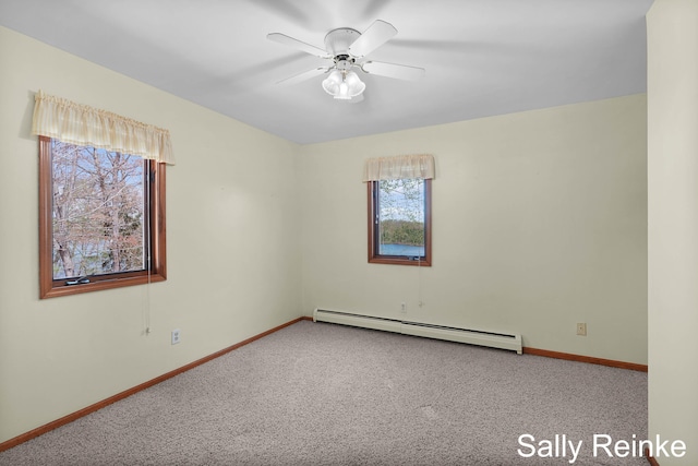 16972 James Dr, Big Rapids, MI 49307 - carpeted spare room with a baseboard heating unit, baseboards, and a ceiling fan