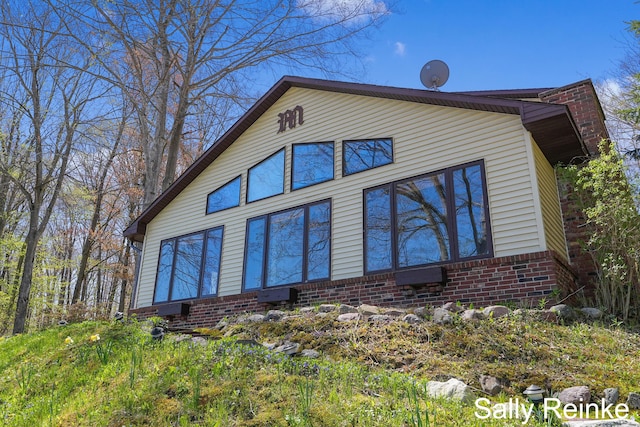 16972 James Dr, Big Rapids, MI 49307 - view of side of property featuring brick siding