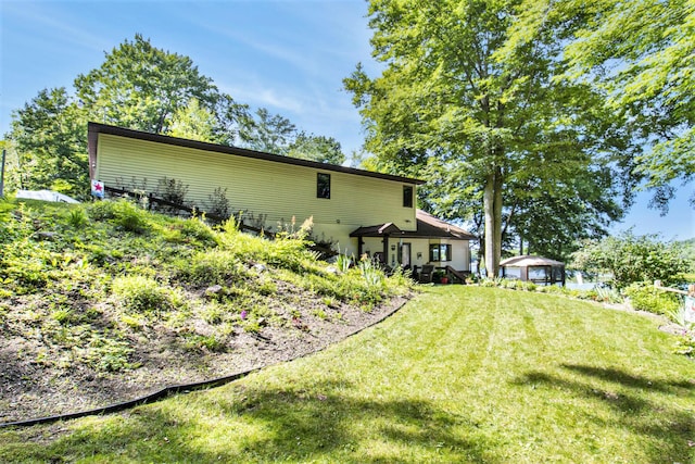 16972 James Dr, Big Rapids, MI 49307 - back of property featuring a yard
