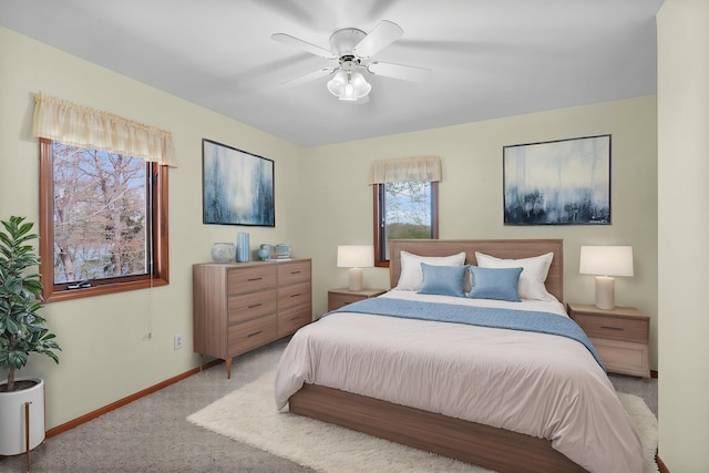 16972 James Dr, Big Rapids, MI 49307 - bedroom with light carpet, baseboards, and a ceiling fan