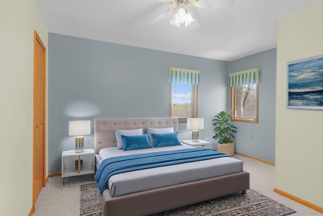 16972 James Dr, Big Rapids, MI 49307 - carpeted bedroom with baseboards and a ceiling fan