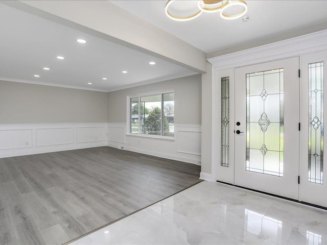 37305 Maas Dr, Sterling Heights, MI 48312 - foyer with ornamental molding, a wainscoted wall, recessed lighting, a decorative wall, and wood finished floors