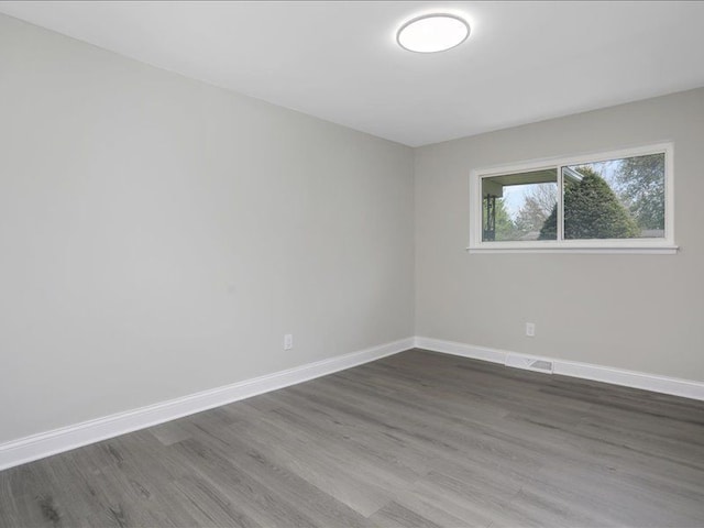 37305 Maas Dr, Sterling Heights, MI 48312 - empty room featuring dark wood finished floors and baseboards