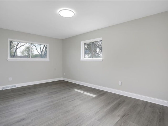 37305 Maas Dr, Sterling Heights, MI 48312 - spare room with baseboards and dark wood-style flooring