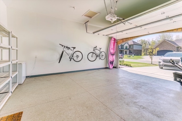 5134 Muirfield Ln, Clarkston, MI 48348 - garage with a garage door opener and baseboards