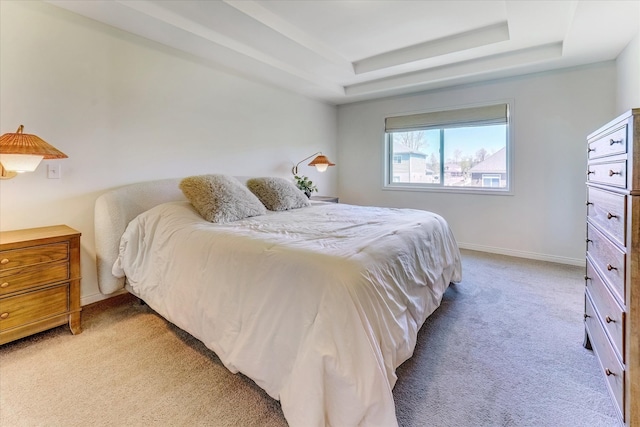 5134 Muirfield Ln, Clarkston, MI 48348 - bedroom featuring a raised ceiling, light carpet, and baseboards
