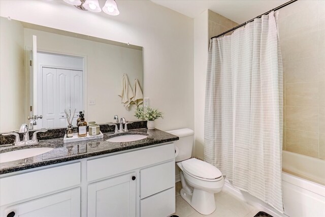 5134 Muirfield Ln, Clarkston, MI 48348 - bathroom with toilet, double vanity, shower / bathtub combination with curtain, and tile patterned flooring