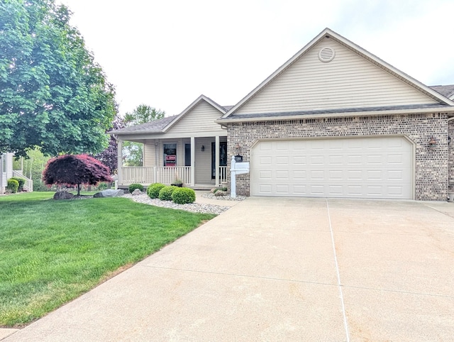ranch-style house with covered porch, driveway, an attached garage, a front lawn, and brick siding