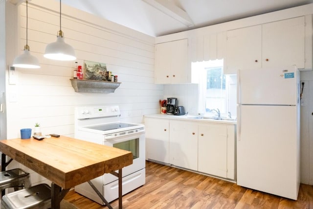kitchen featuring white appliances, a sink, light countertops, white cabinets, and light wood finished floors